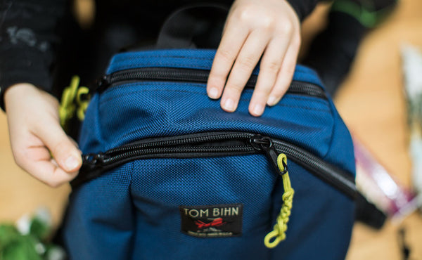 A close shot of the main and top zippers of The Sprout.